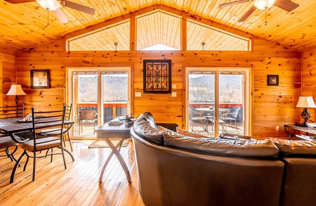 Charming riverside with stunning views, cozy interiors, full amenities, and spacious decks.