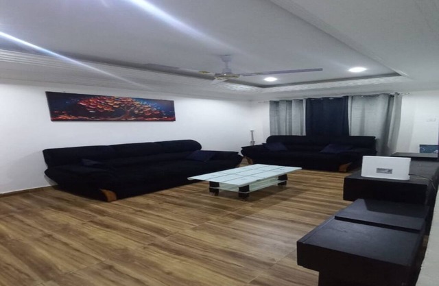 Comfy 2-bedroom apartment in Accra with AC, WiFi, Kitchen, Living room.