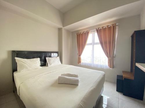 Comfy 2BR Apartment at Newton Residence near Tol Buah Batu By Travelio