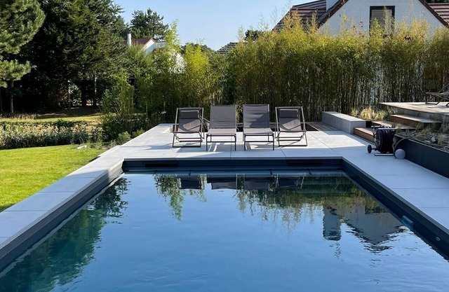 Contemporary wooden villa on the golf course with swimming pool