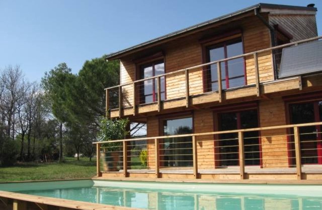 contemporary architect house made of wood in a preserved nature area