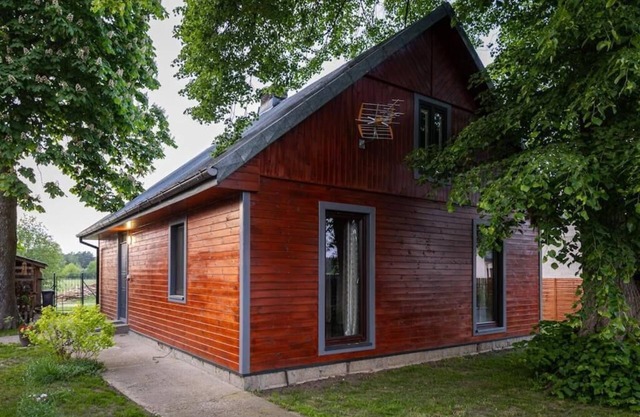 Cosy country house surrounded by a river, forests and meadows.