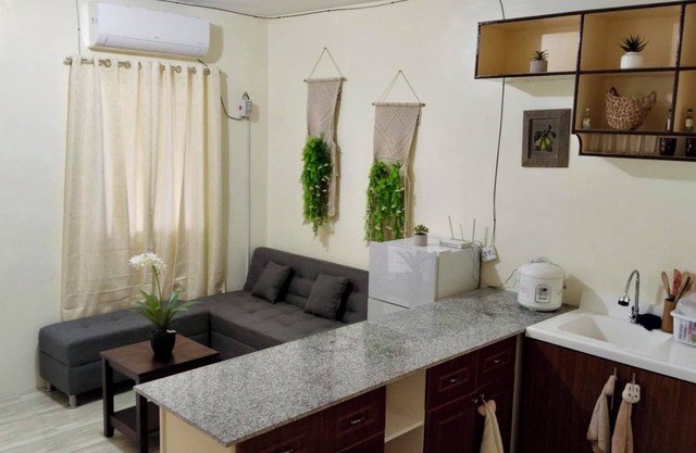 Cozy 2-bedroom townhome with basic amenities, AC, high-speed WiFi,24/7 security.