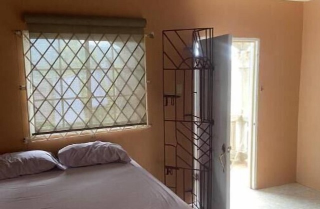Cozy accommodation in the cool hills of ,Mandeville with a view of the ocean