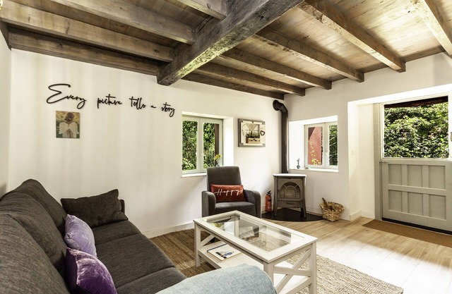 Cozy cottage besides a stream and a river