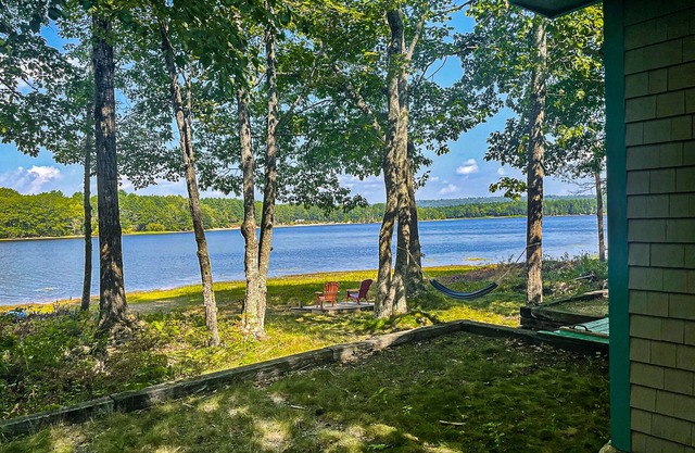Cozy lakefront cabin with amazing views, deck, firepit, & water access