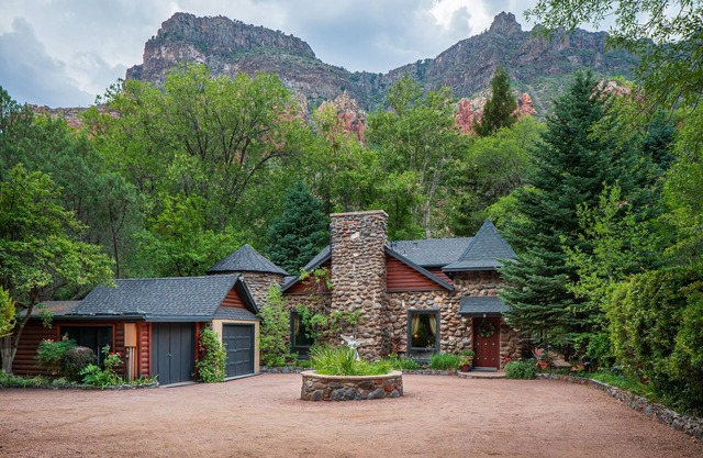 Creekside Chateau,patio overlooks Oak Creek, with steps directly to the water