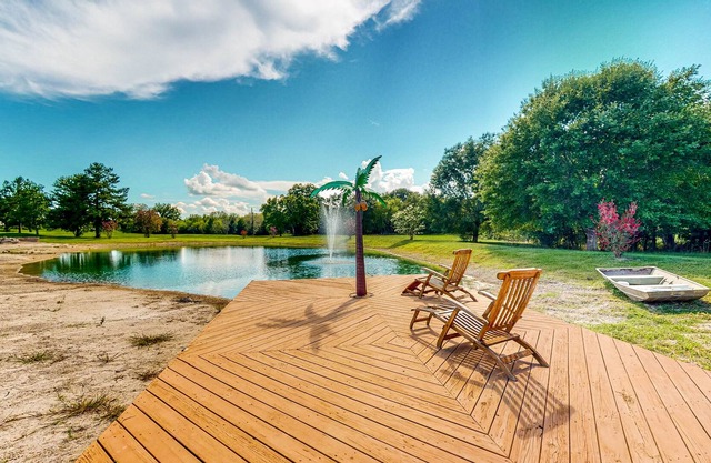 Custom Home with Guesthouse, Pond, Swimming Deck, Beach & Tropical Bar
