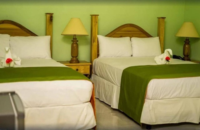 Deluxe Quadruple Room, 2 Queen Beds, Garden View