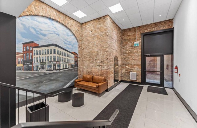Designer Loft 1BR Exposed Brick Bay Windows