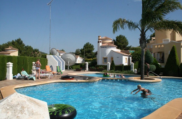 Detached villa with garden and communal pool