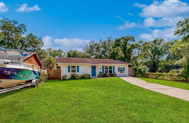 Dog-friendly home with fenced yard, firepit, washer/dryer, & central AC