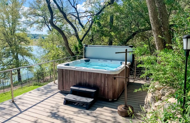 Dog-friendly riverfront home with dock, private hot tub, game room, amazing view