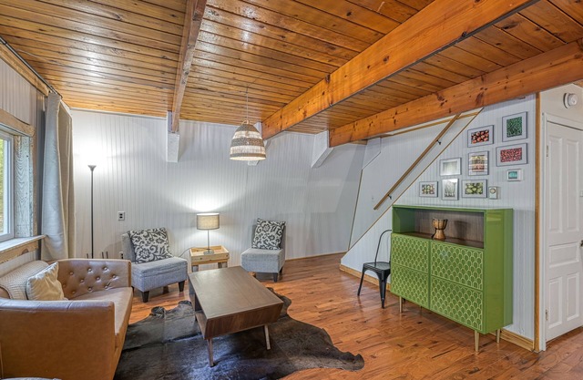Dog-friendly secluded cabin with hot tub, firepit, lawn games, & great deck