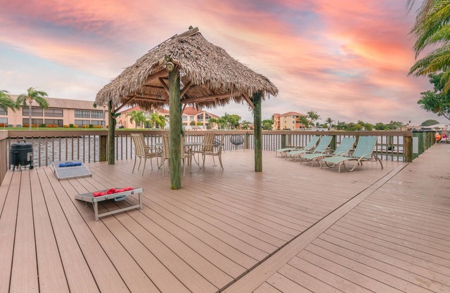 Enchanting tropical waterfront villa with boat slip, bikes, kayaks heated pool!