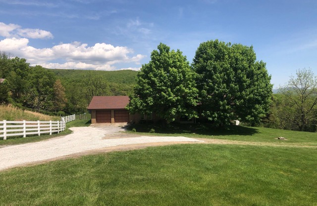 Enjoy this private mountain retreat with stunning views on 230 acres