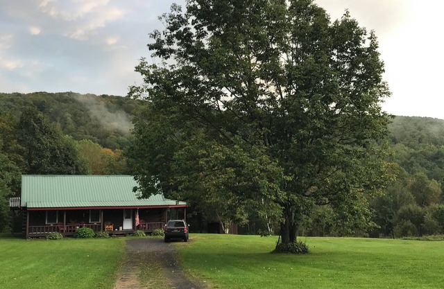 Escape to the country at our creek-side log cabin.