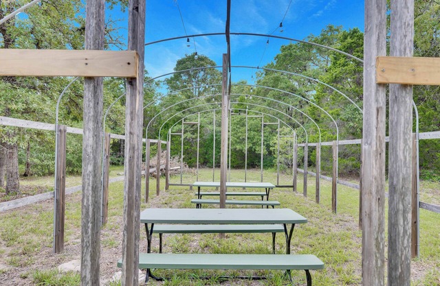 Escape to this beautifully remodeled farmhouse on private, open green space.