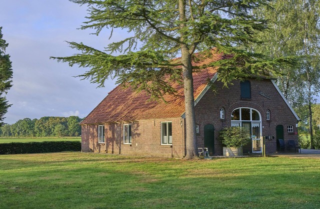 Farmhouse with large garden and play equipment