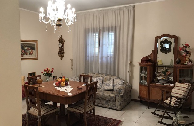 Fausto's house is an apartment on the first floor of a two-storey building.