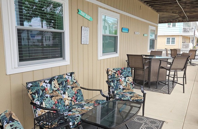 FEEL THE OCEAN BREEZE ON THE LARGE PORCH WHILE ENJOYING YOUR FAVORITE BEVERAGE