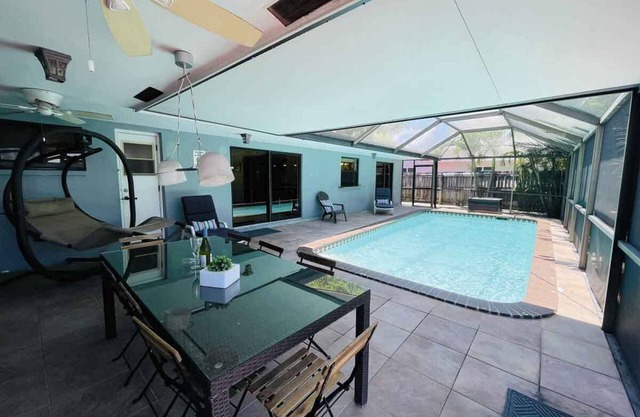 Fort Lauderdale 4/2 with screened-in pool and dock.