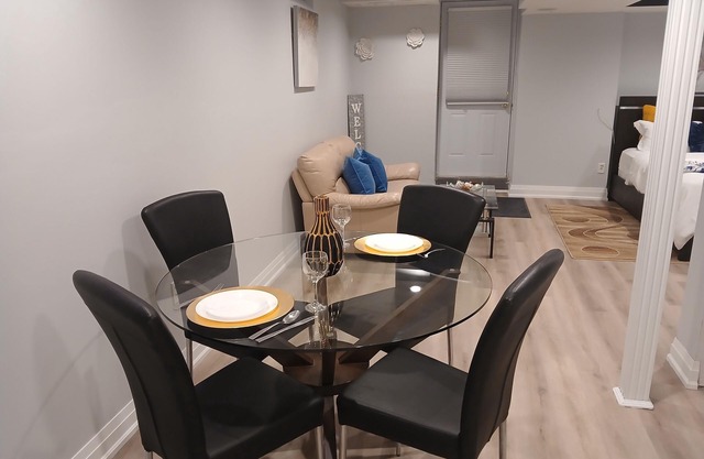 furnished basement studio, with1 queen bed, a kitchenette, and 1 bathroom. n