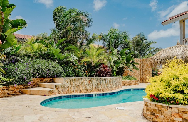 Gorgeous modern 1-bedroom apartment with tropical garden, pool and whirlpool