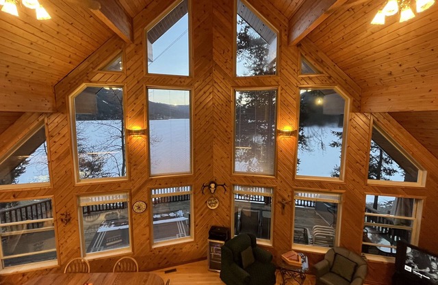 High-end three-level 3,000 sq ft home boasts 150 ft of private beachfront.