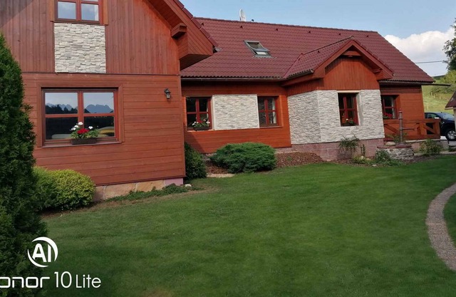 Holiday home with outdoor swimming pool and playground