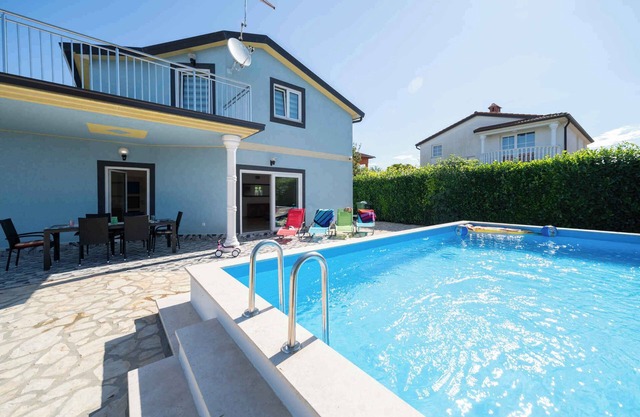 Holiday home with pool and barbecue