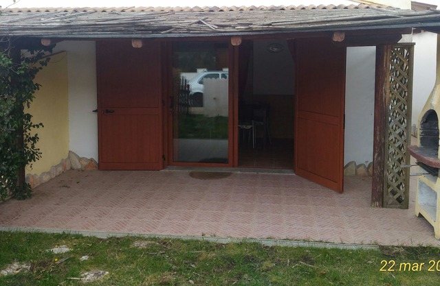 Holiday home with swimming pool, veranda and garden.