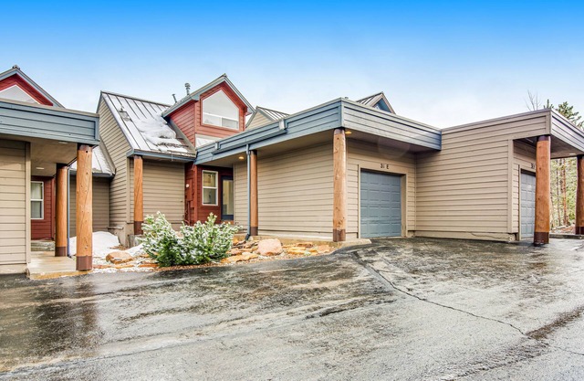 Home with hot tub, gas fireplace, and garage