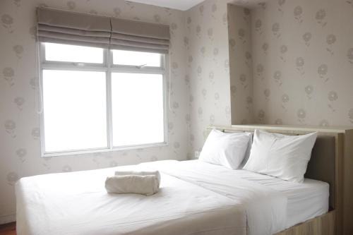 Homey and Chic 2BR Apartment Newton Residence Bandung By Travelio