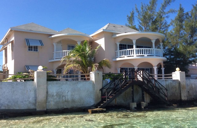 House by the sea with a small sandy beach, pool and fantastic views