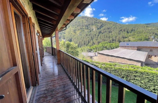 House in the middle of nature surrounded by mountains