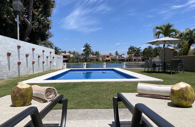 House with pool and lake view