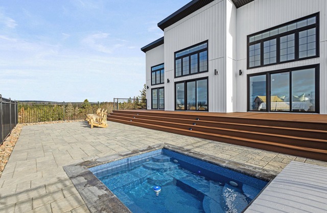 In ground HOT TUB + 2 primary bedrooms w/ensuites