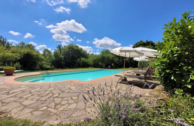 Independent holiday house surrounded by a wide fenced garden with pool , located in the Tuscan coun