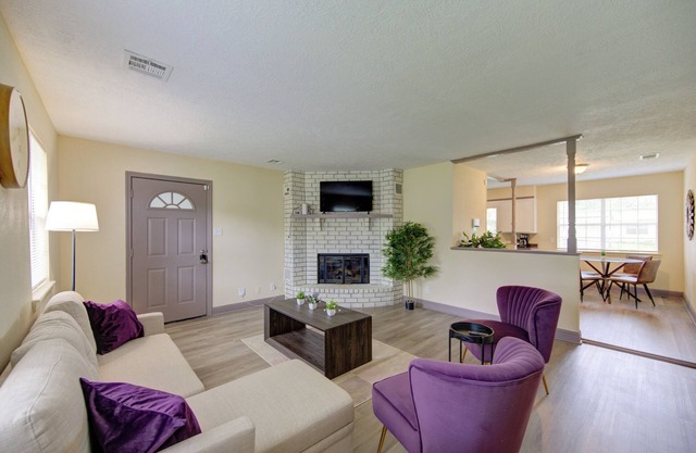 Indoor fireplace with patio and pool table