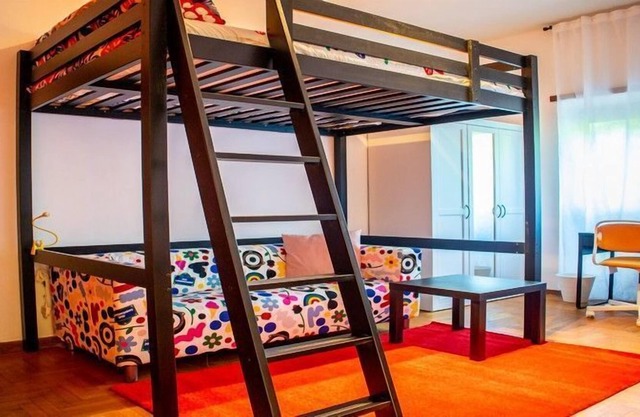 KAMCHŪ APARTMENTS VILLA CHIGI: PRIVATE DOUBLE BEDROOM, LOUNGE AREA with SOFA #L2