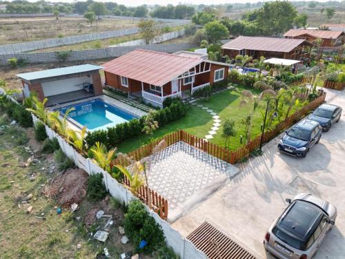Kuku farm stay 3 bedroom wooden cottage with private pool at Moinabad