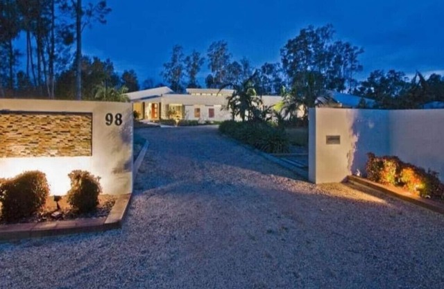 Lake Palm Retreat - shared pool and waterfront