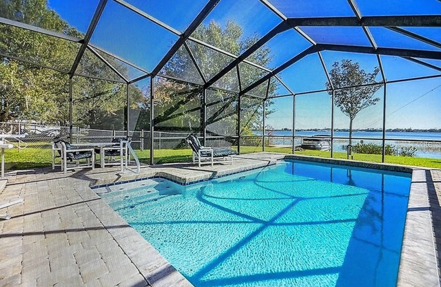 Lake Shipp House with pool and dock on the water