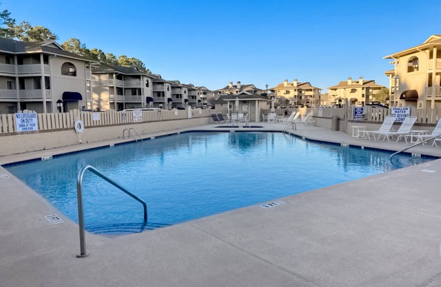 Lake-view 3rd-floor condo with balcony, hot tub, outdoor pool, washer/dryer, AC