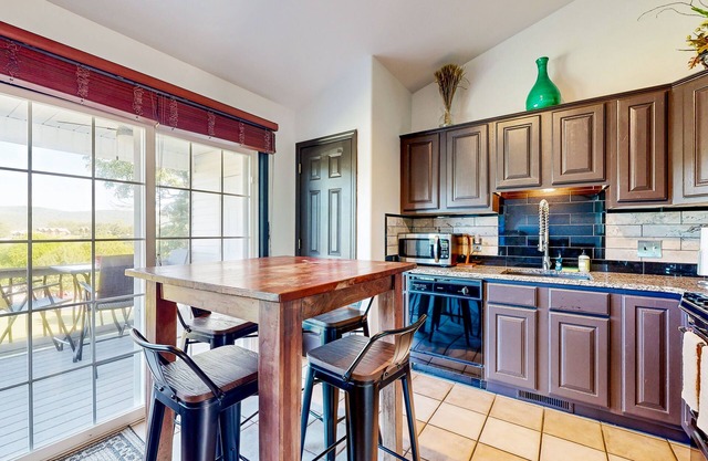 Lake view condo with fireplace, firepit, deck & central AC