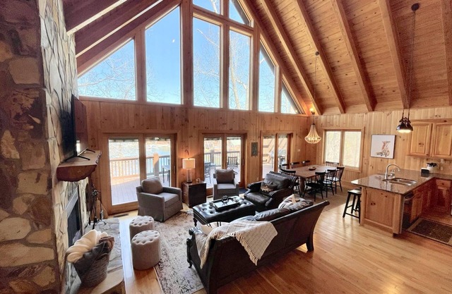 Lakefront house with multiple outdoor areas, fire pit, dock and two kayaks