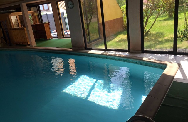 Large air-conditioned room for 1 to 4 people with access to the communal swimming pool