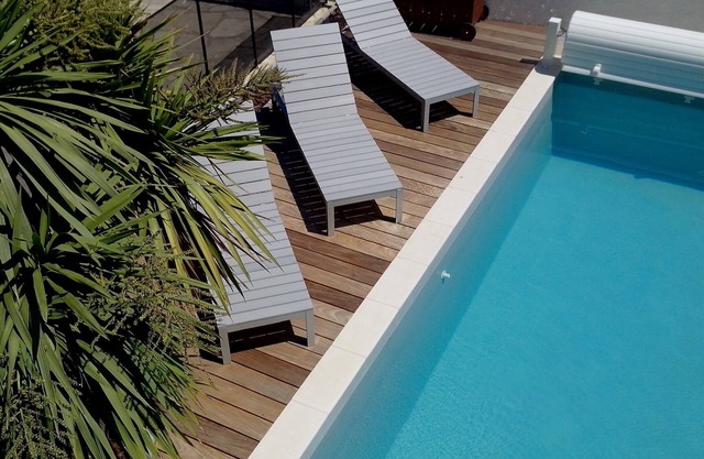 Large holiday home with pool just steps from the beach