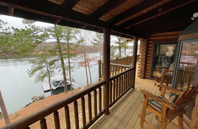 Large six-bedroom log home w/private boat ramp, dock, movie room and pool room.